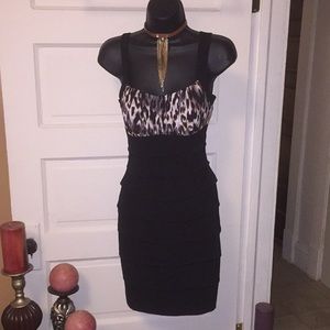Smoking hot in this body con dress leopard print